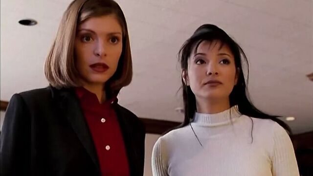 Kelly Hu in skintight snakeskin vinyl pants